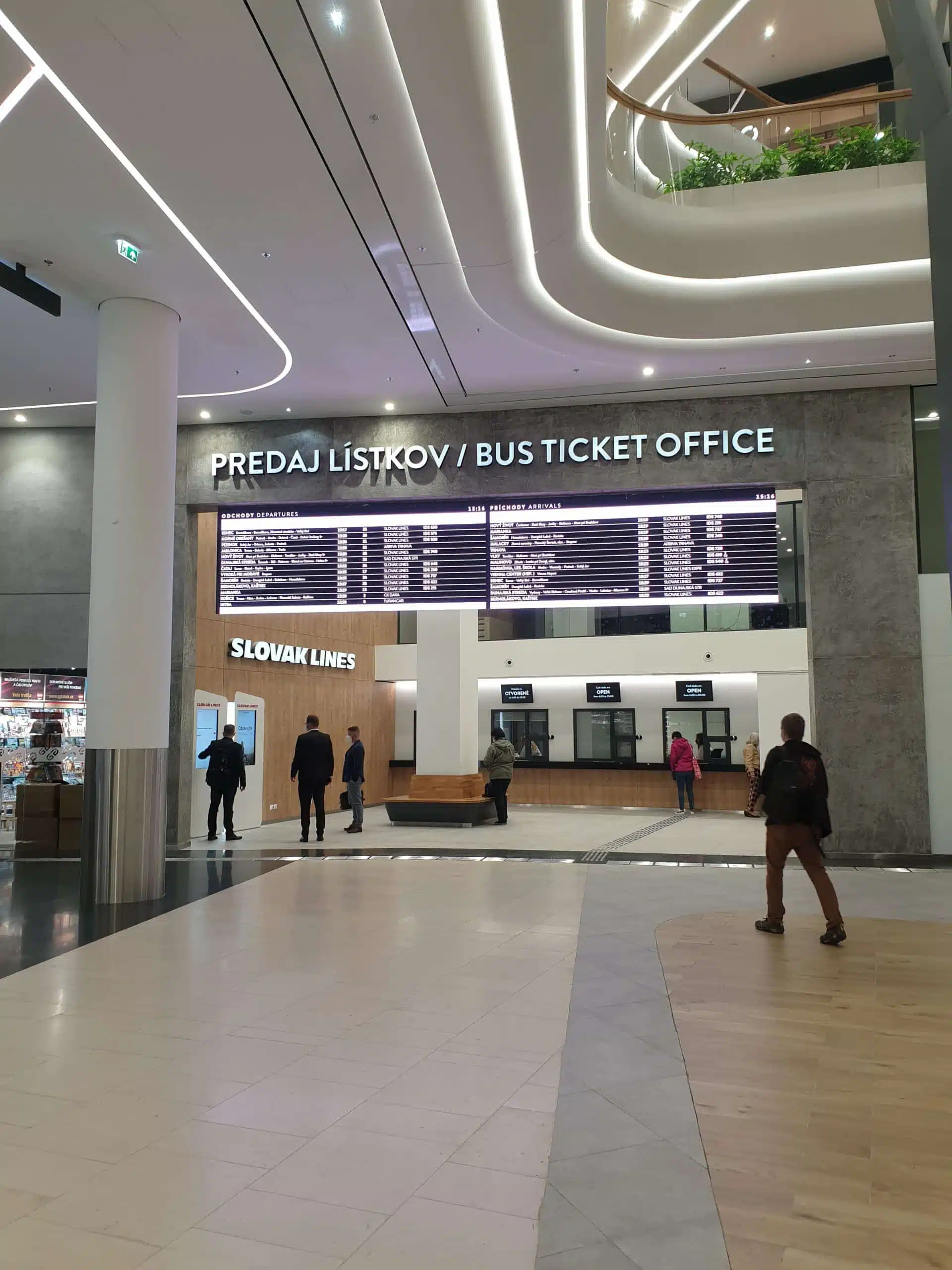 A led Wall on top of the ticket office combined with screens on desk informing if cashier is free or busy.